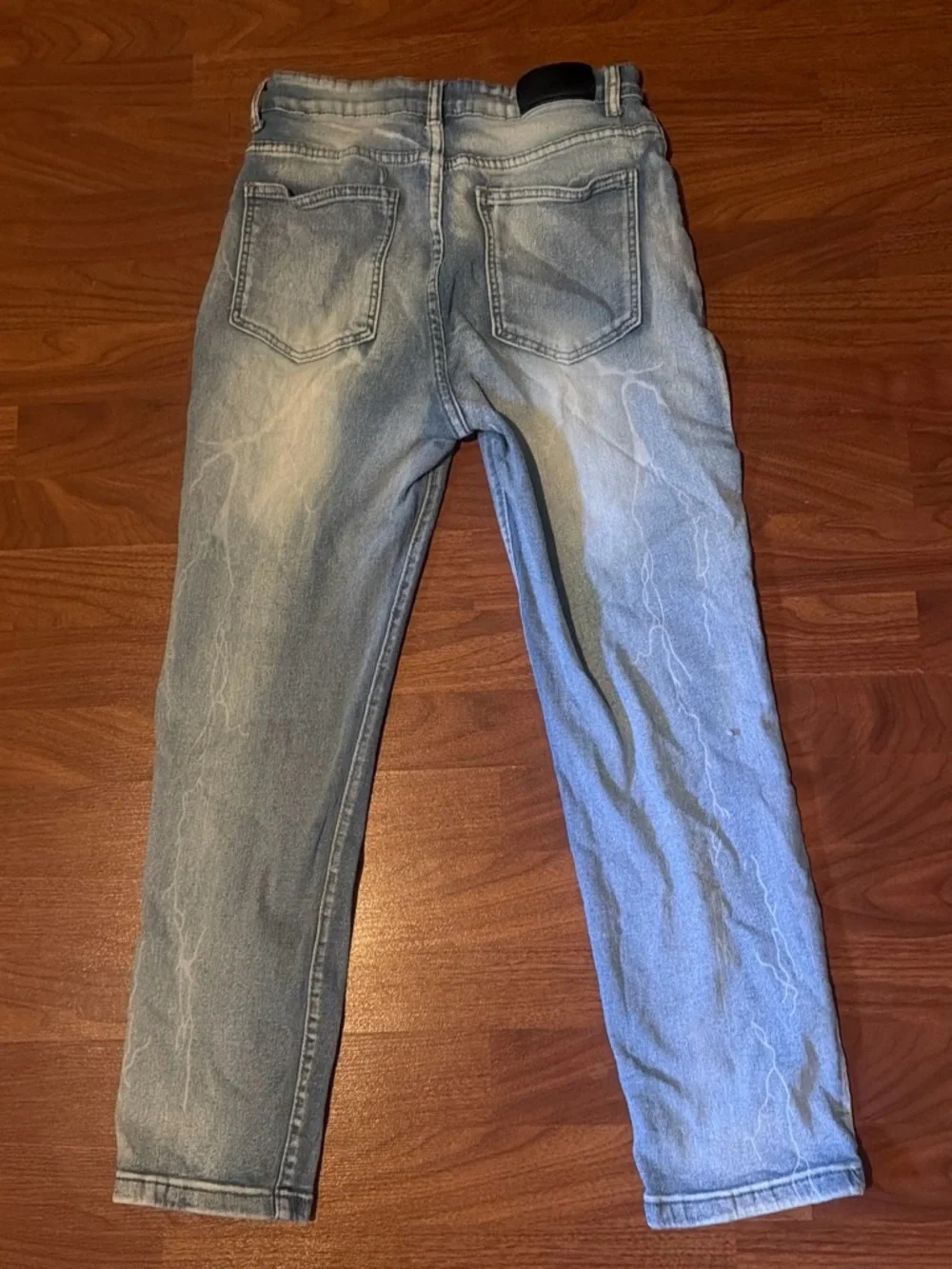 Light Wash Blue Men’s Amiri Jeans with White Script Patch